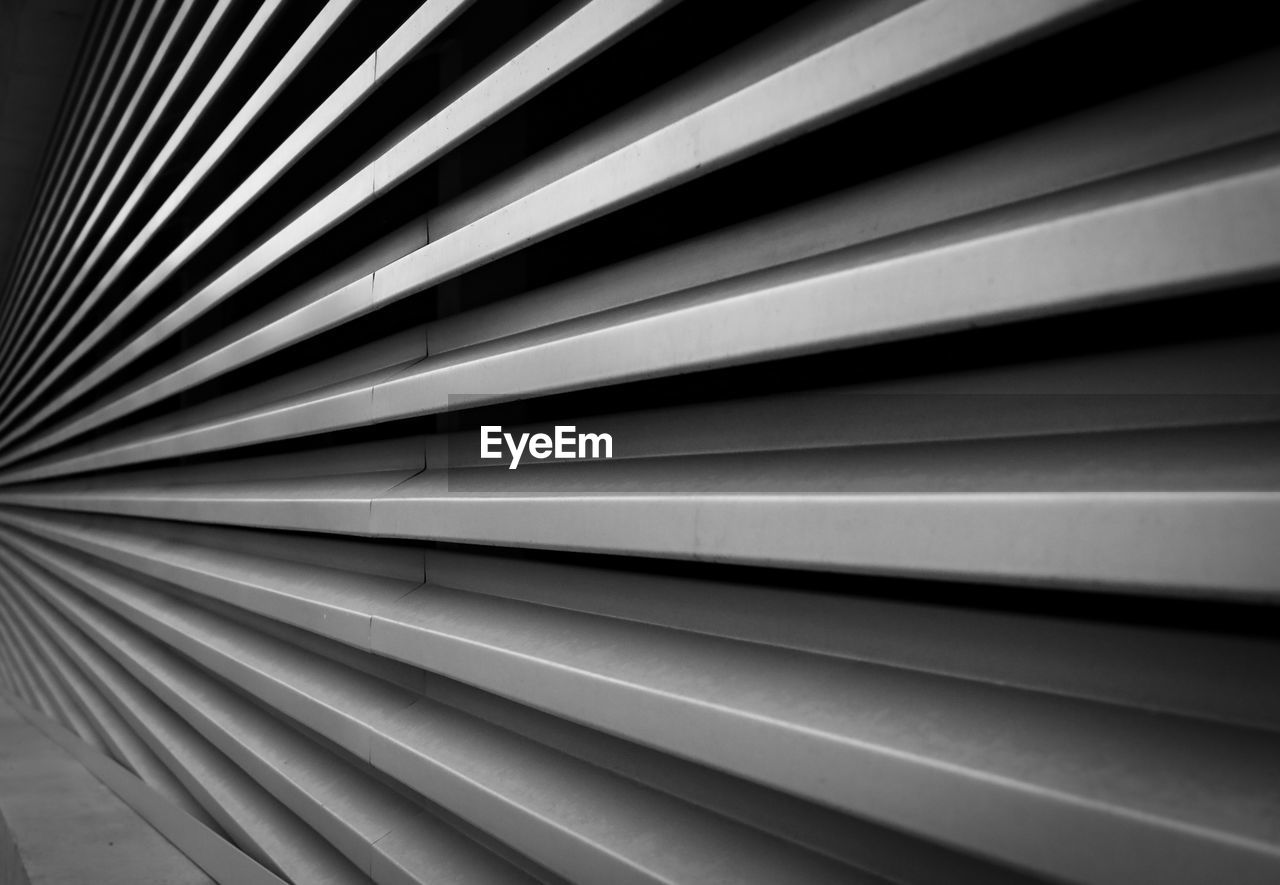 black and white, pattern, line, monochrome, backgrounds, monochrome photography, full frame, no people, window covering, interior design, close-up, abstract, light, architecture, indoors, metal, repetition, black, textured, built structure, white, striped