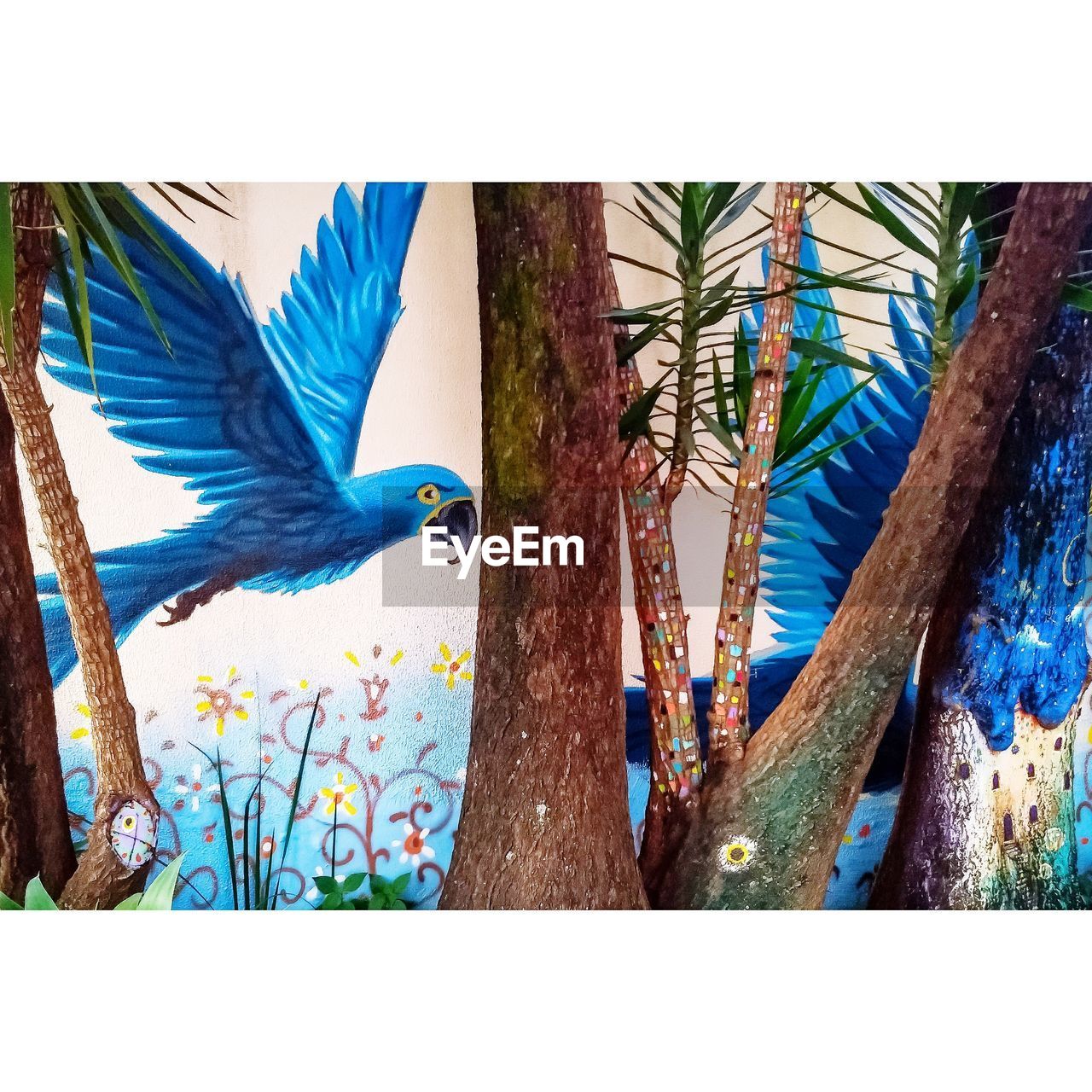 VIEW OF A BIRD PERCHING ON TREE