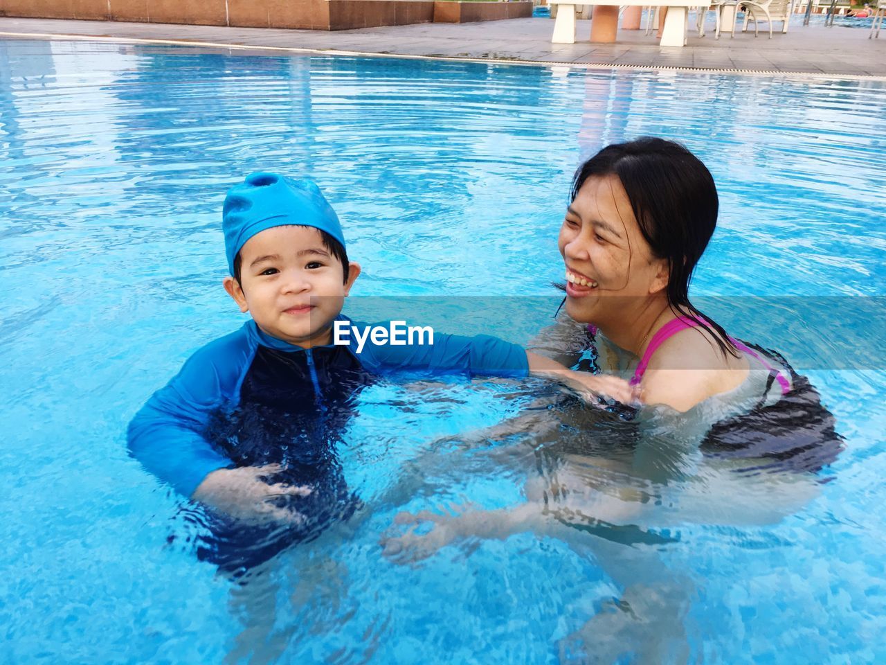 High angle view of woman swimming in pool