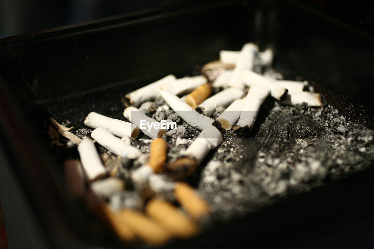 Close-up of cigarettes in ashtray