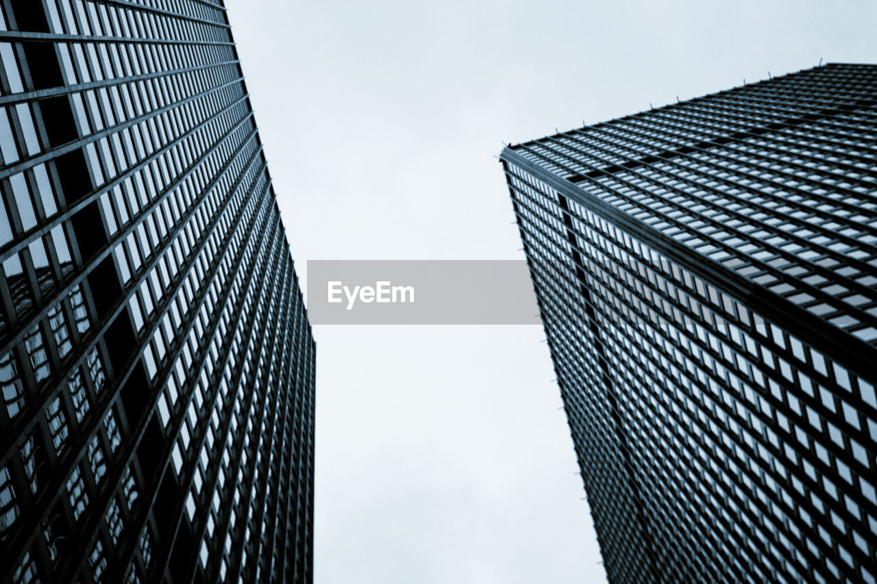 LOW ANGLE VIEW OF MODERN BUILDINGS AGAINST SKY