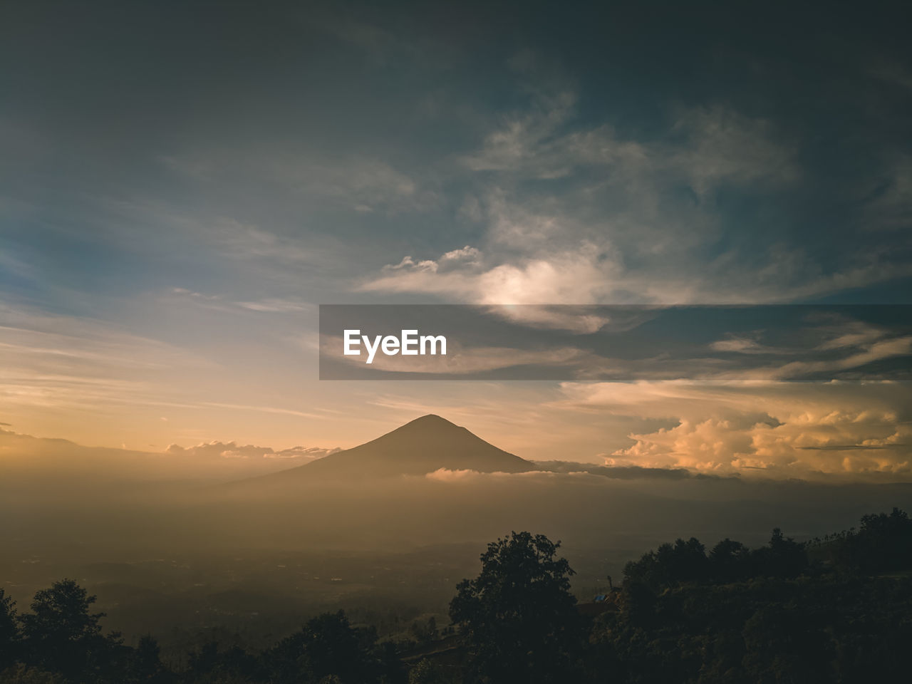 Scenic view of silhouette mountains against sky at sunset