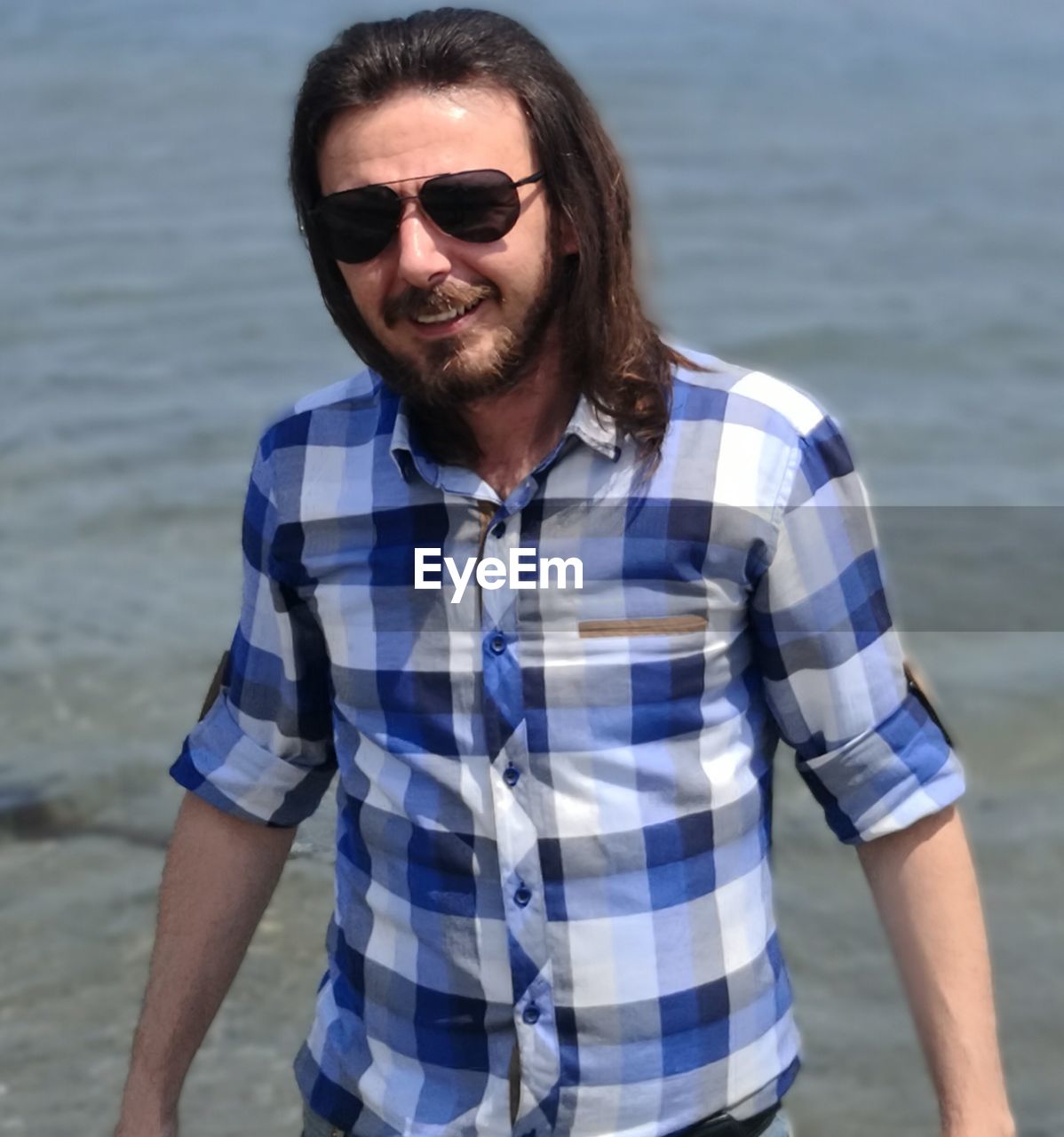 Portrait of man standing in sea