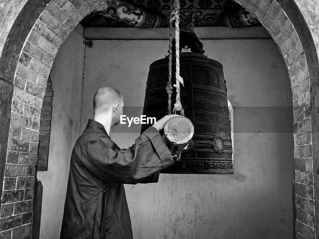 Kung fu master ringing bell at shaolin temple greece