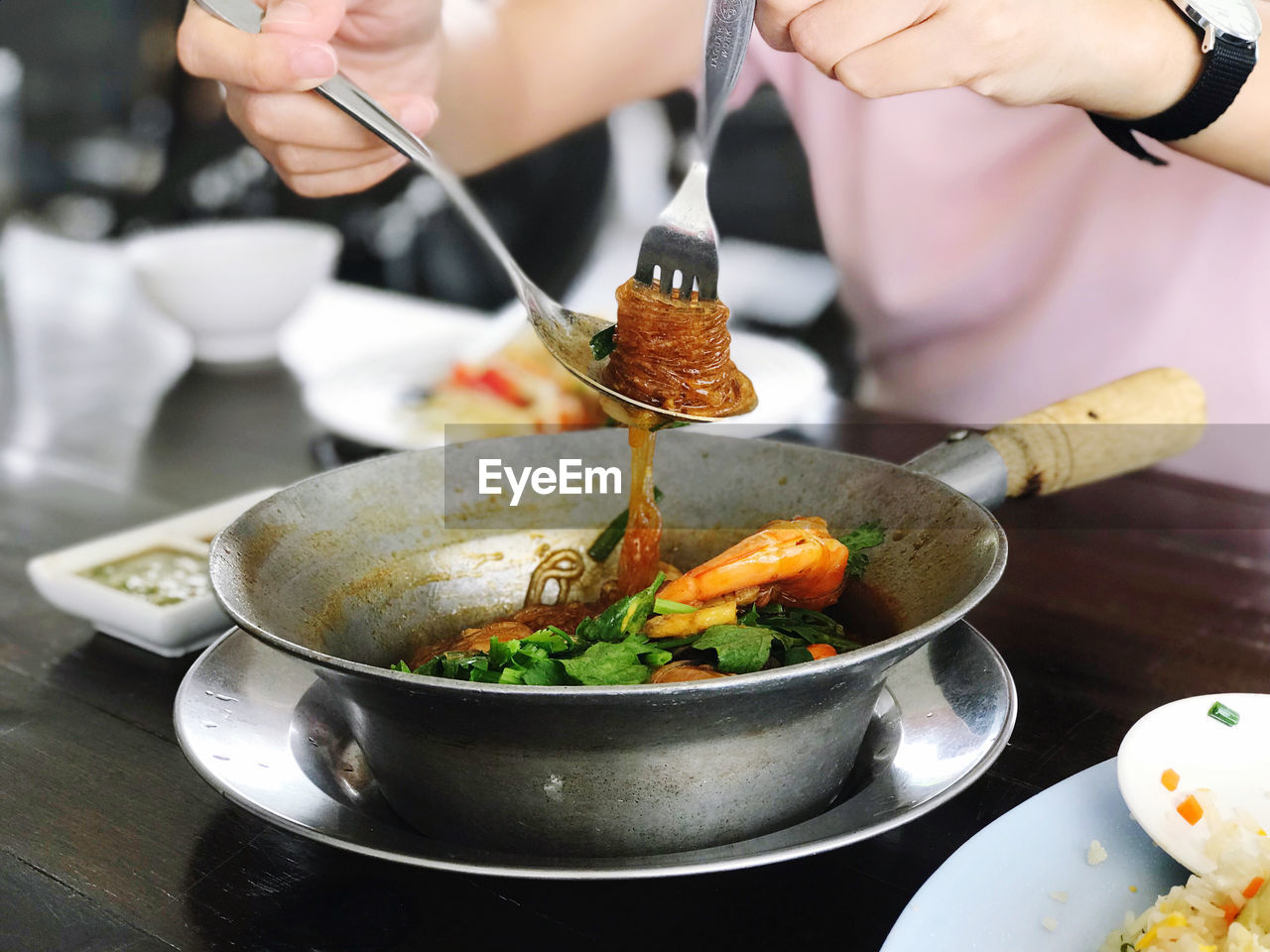 cropped hand of man preparing food