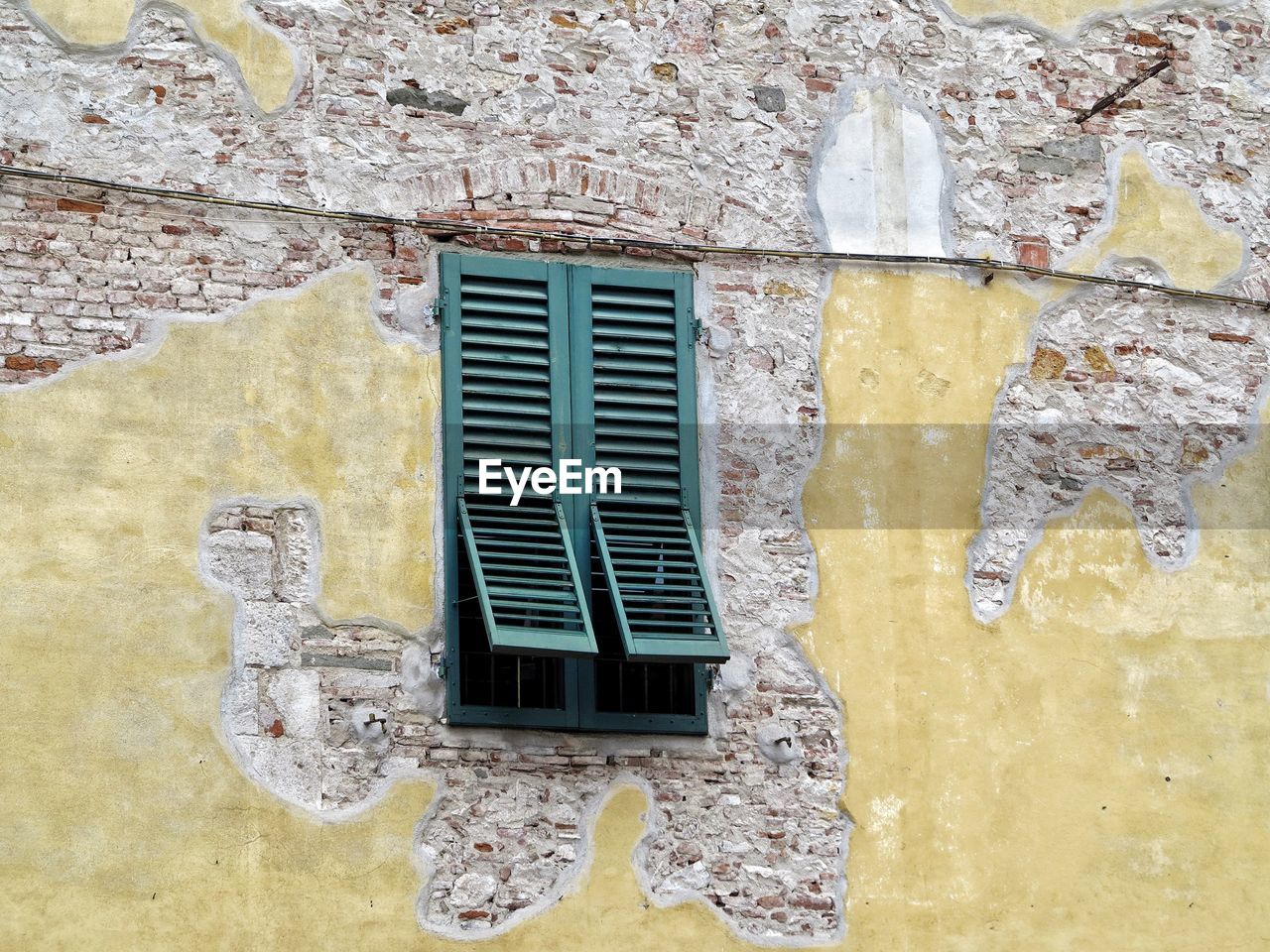 Close-up of window on wall of building