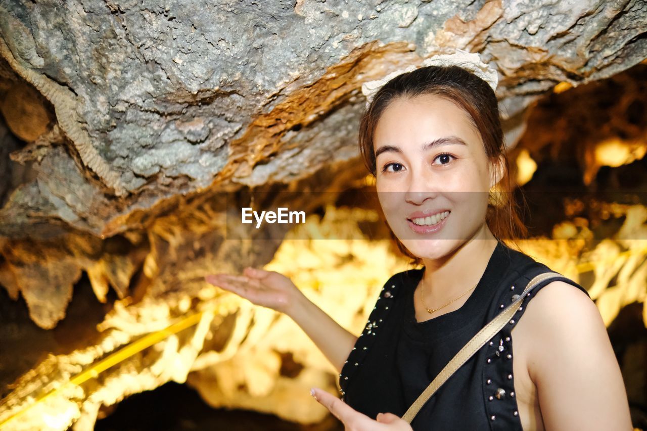 Cave girl in between cave hole