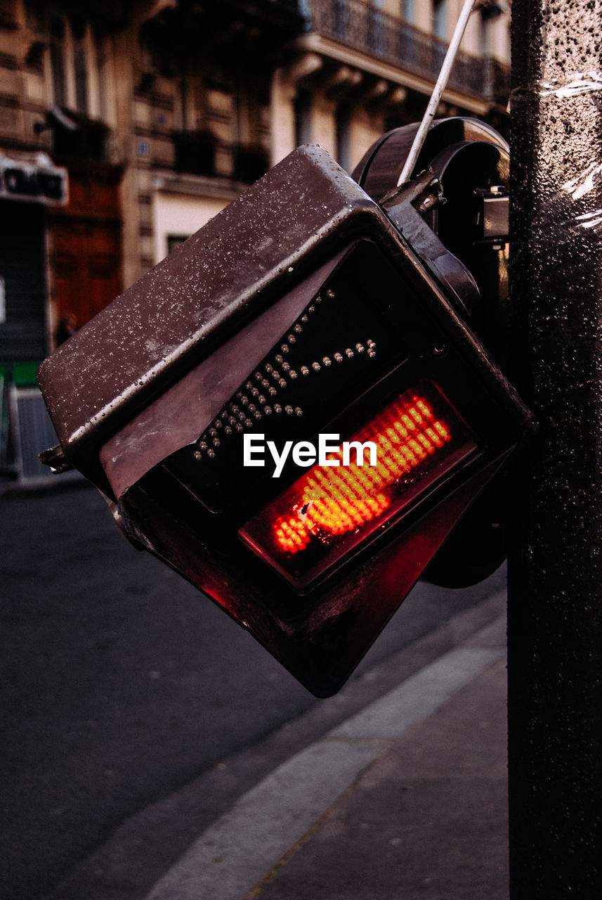 Close-up of broken stoplight in city