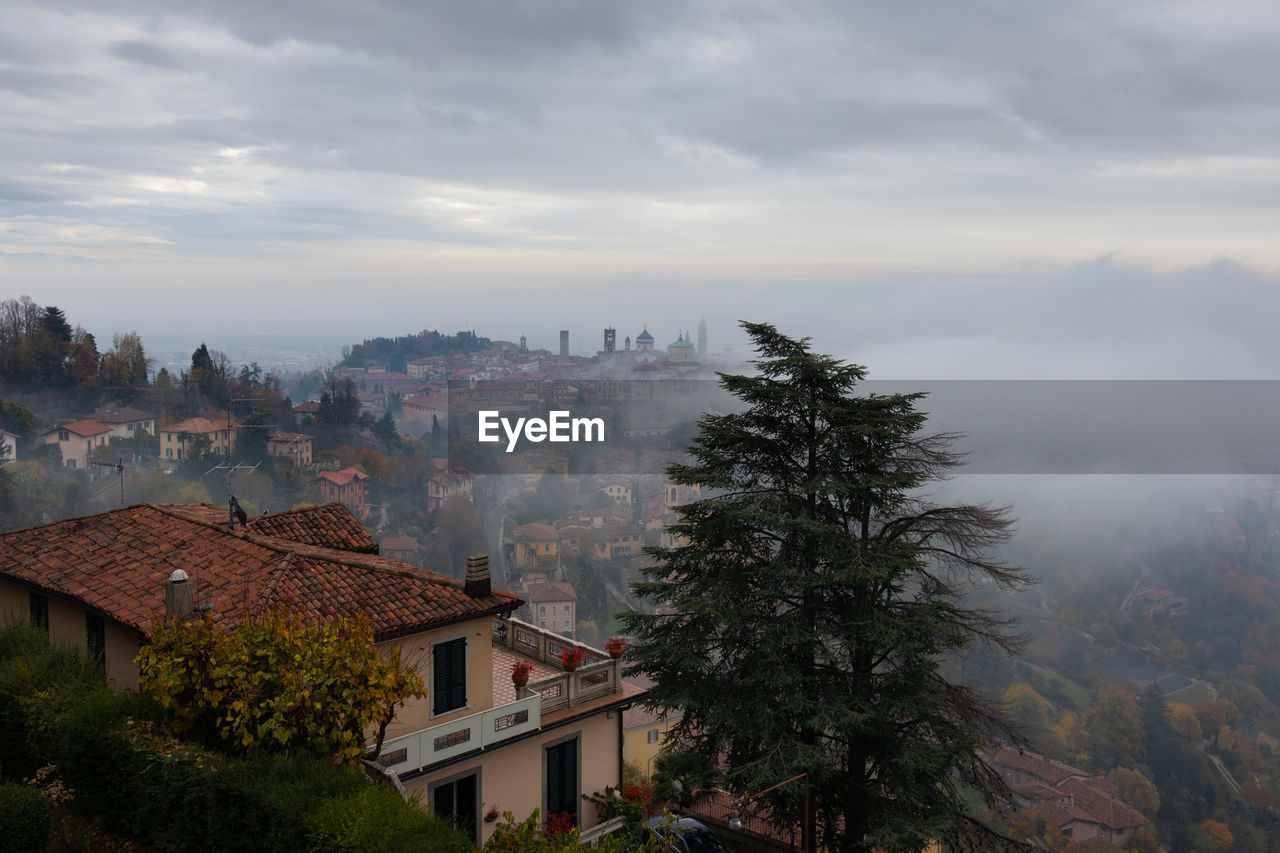 A thick fog enveloped the upper city of bergamo.