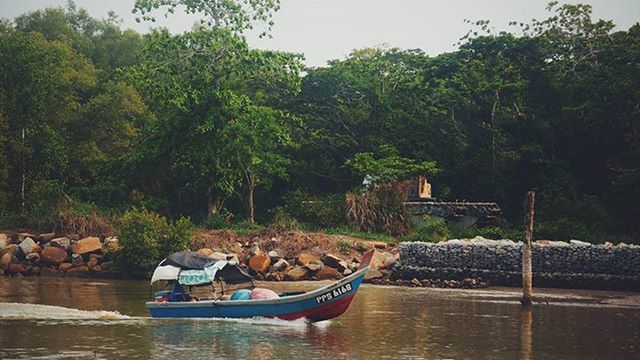 VIEW OF BOATS IN SEA