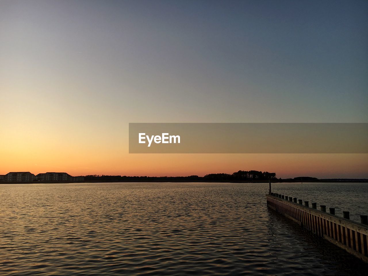 Scenic view of sea against clear sky during sunset