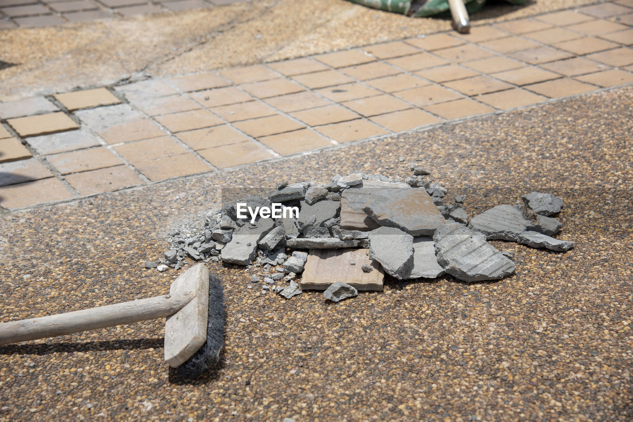 HIGH ANGLE VIEW OF STONES ON STREET