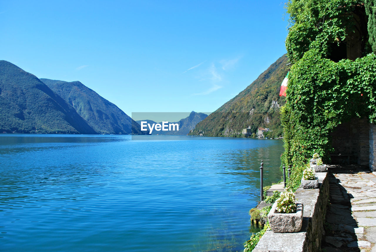 Scenic view of lake against blue sky