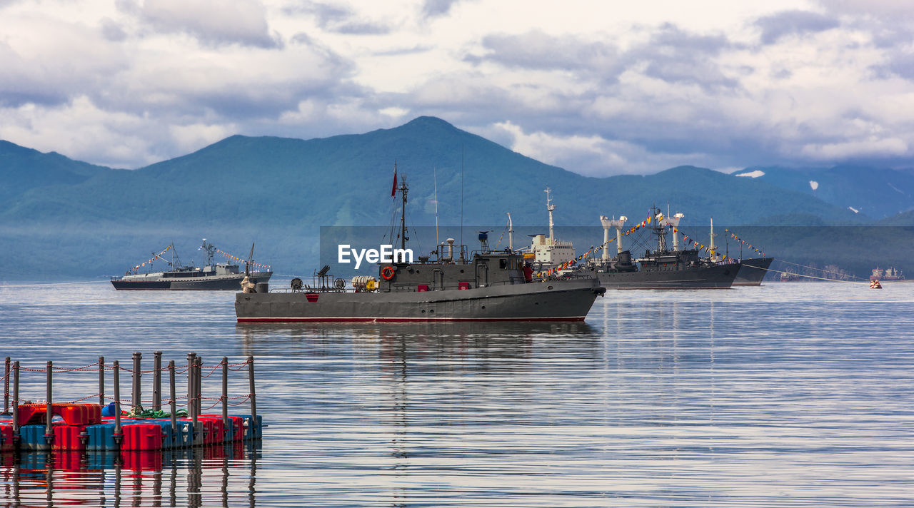 Warships in the maritime parade on bay on pacific ocean