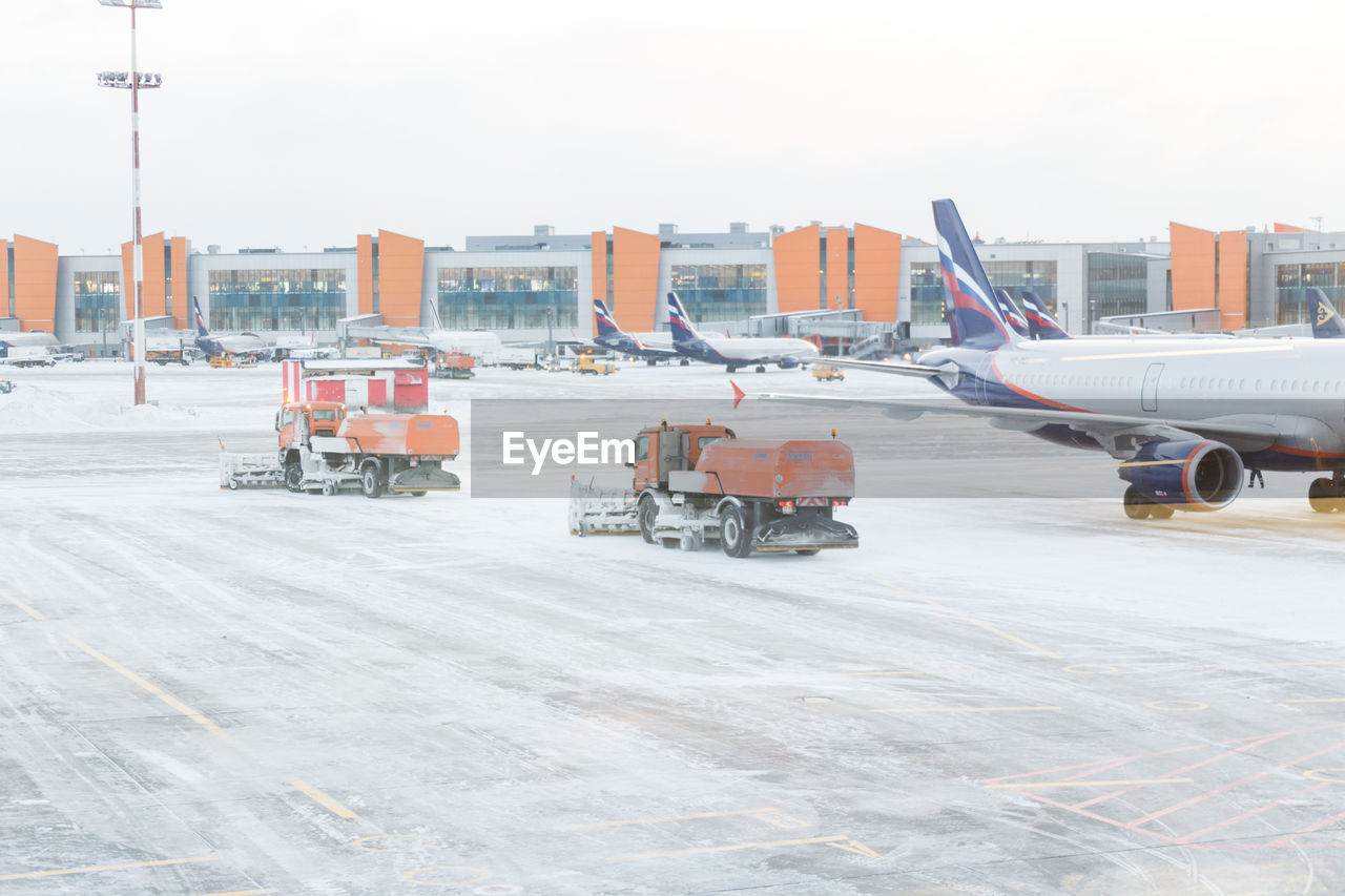 AIRPLANE ON RUNWAY AGAINST SKY