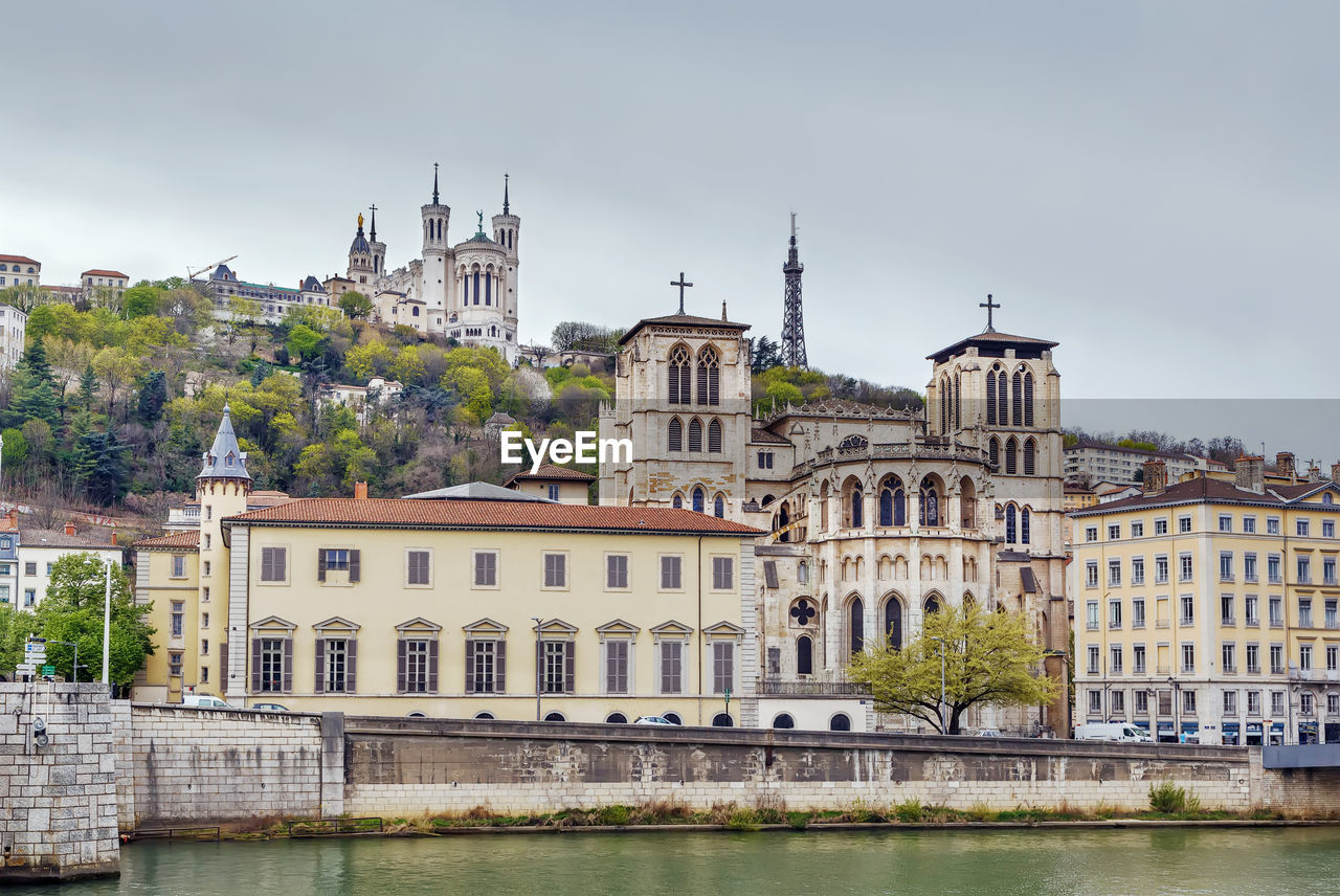 VIEW OF BUILDINGS BY RIVER