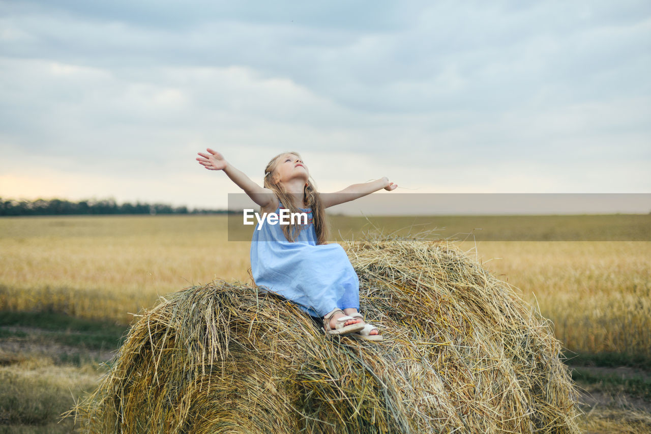 Girl in a wheat field on a barley