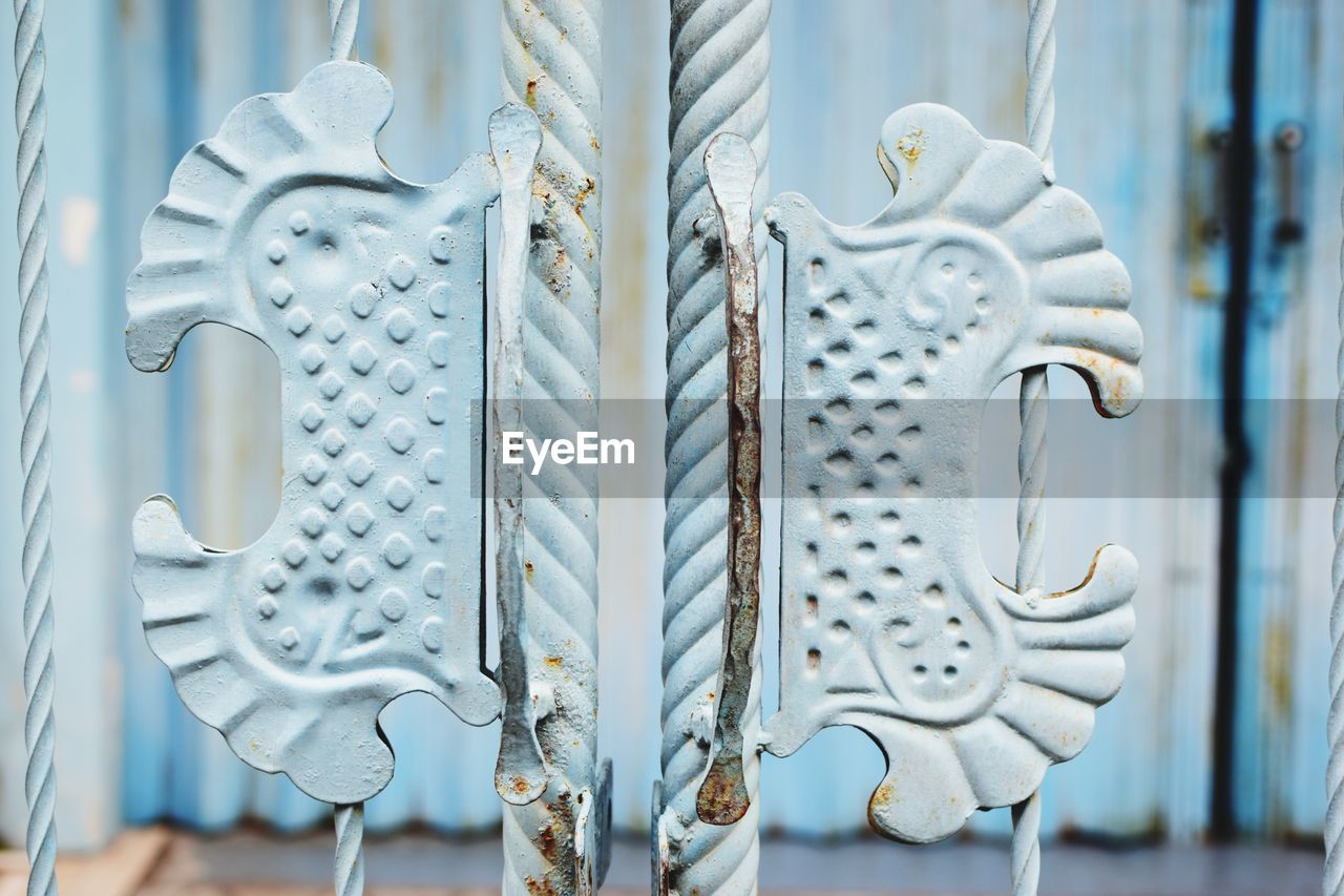 Close-up of chain hanging on metal structure