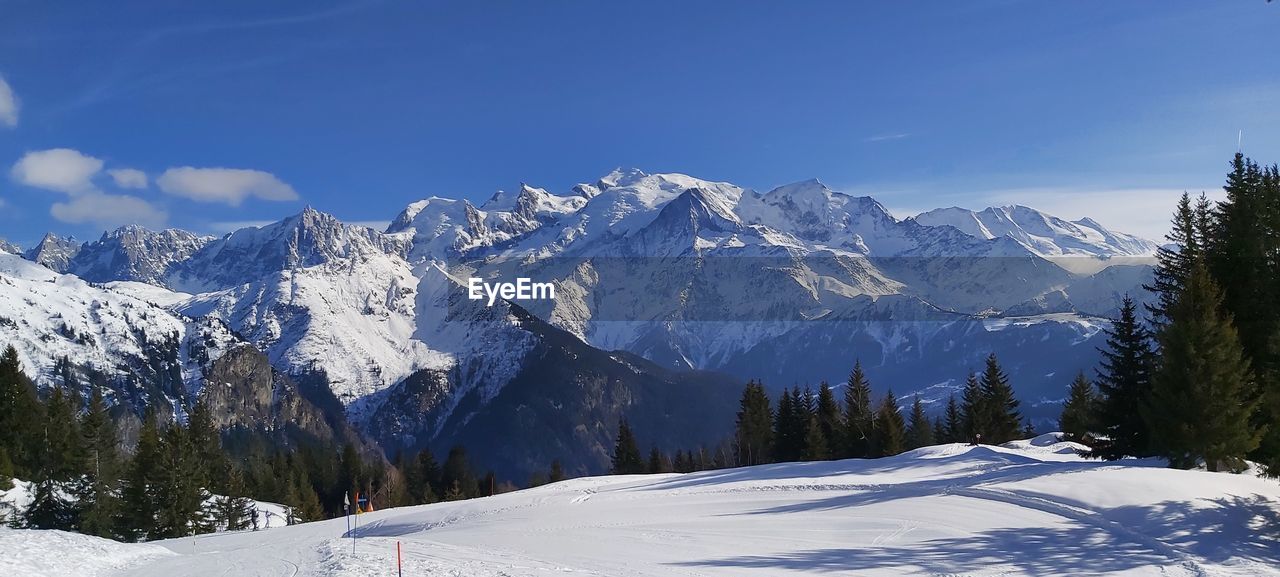 Snow covered mountains against sky