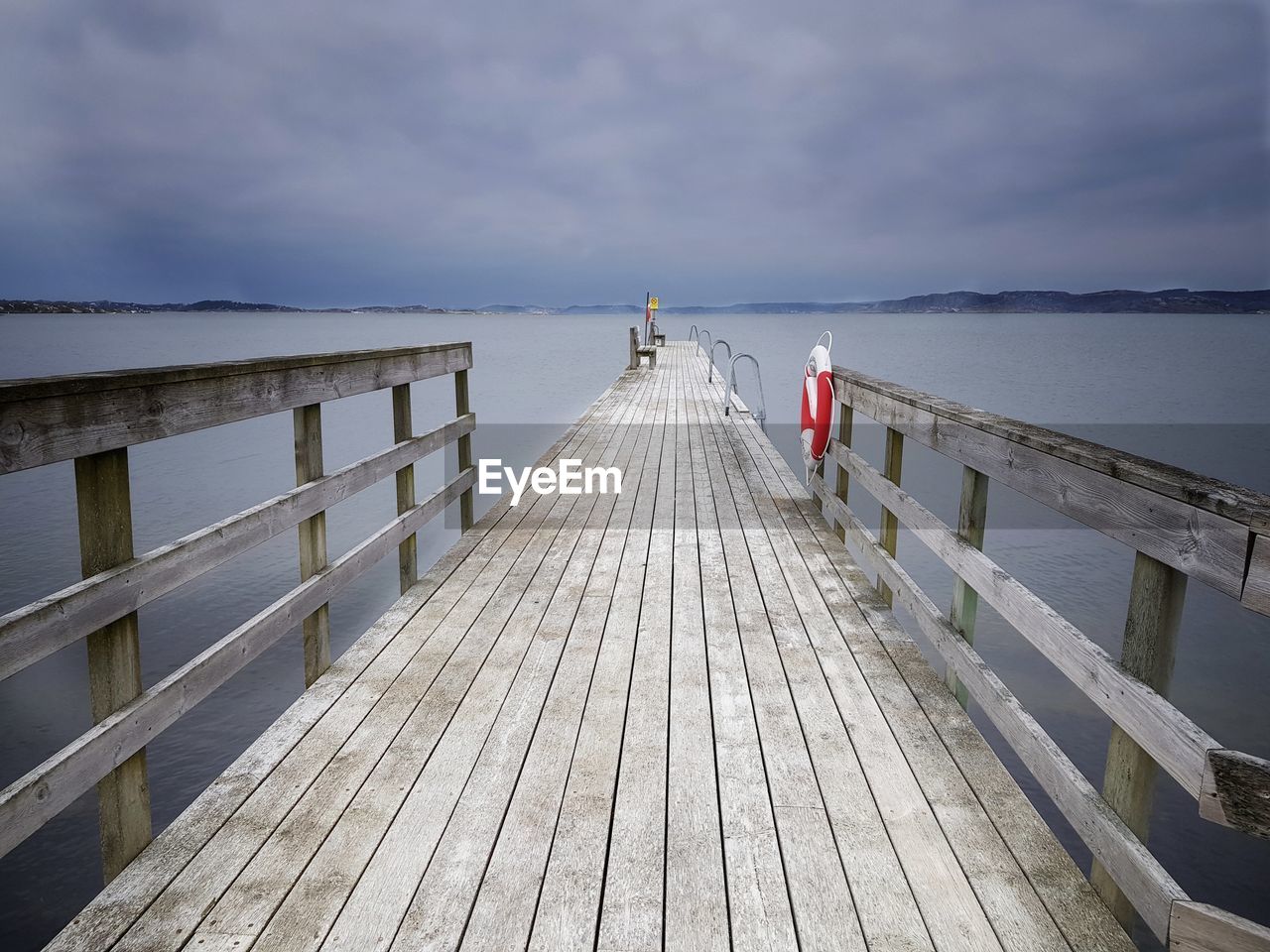 Pier over sea against sky