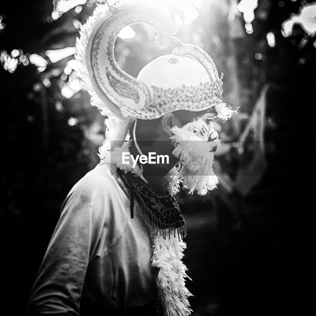 Side view of boy wearing costume standing outdoors