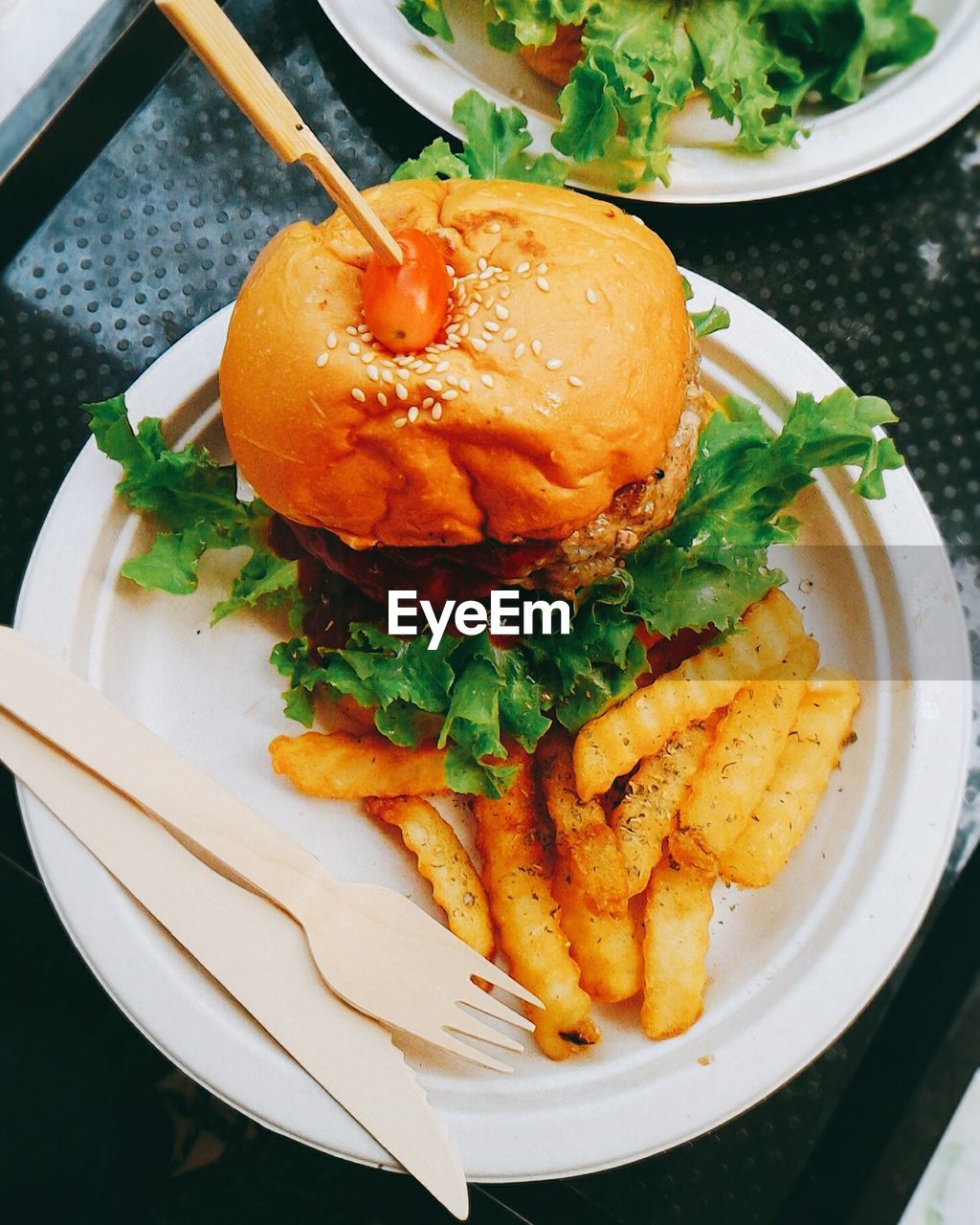 High angle view of burger and french fried in plate