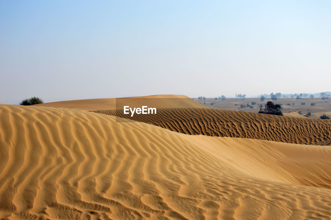 Scenic view of desert against clear sky