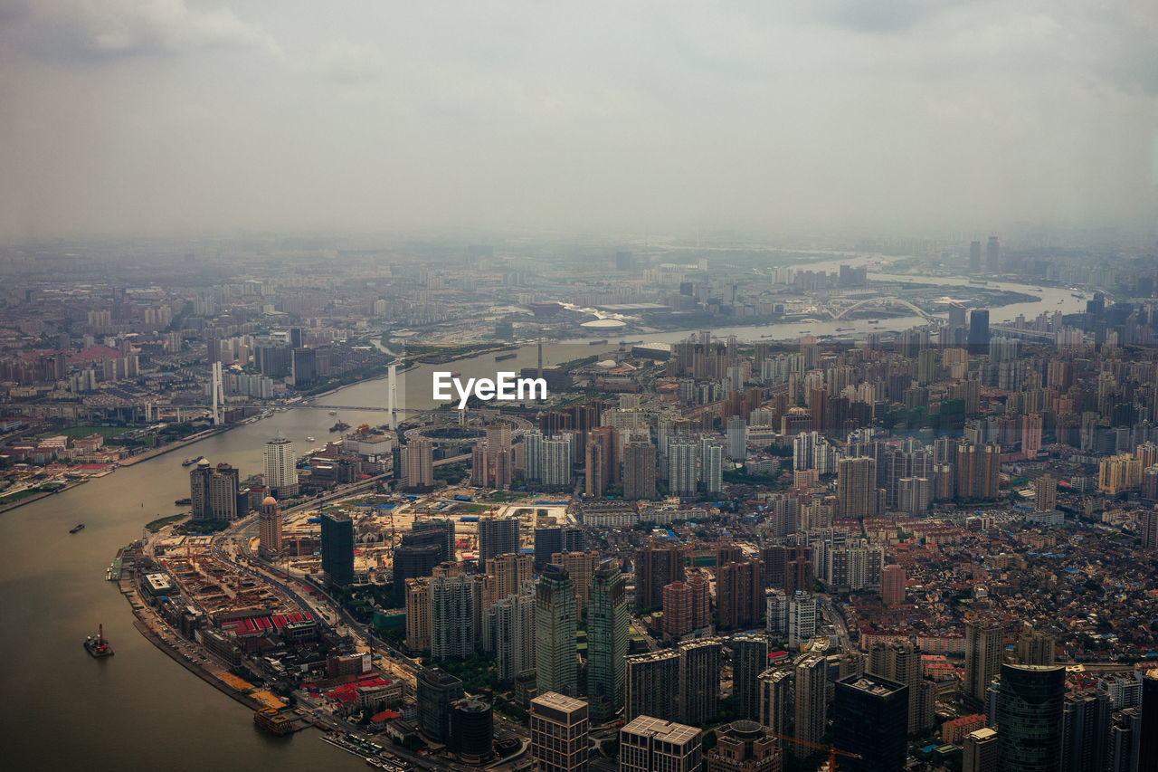 Aerial view of cityscape against sky