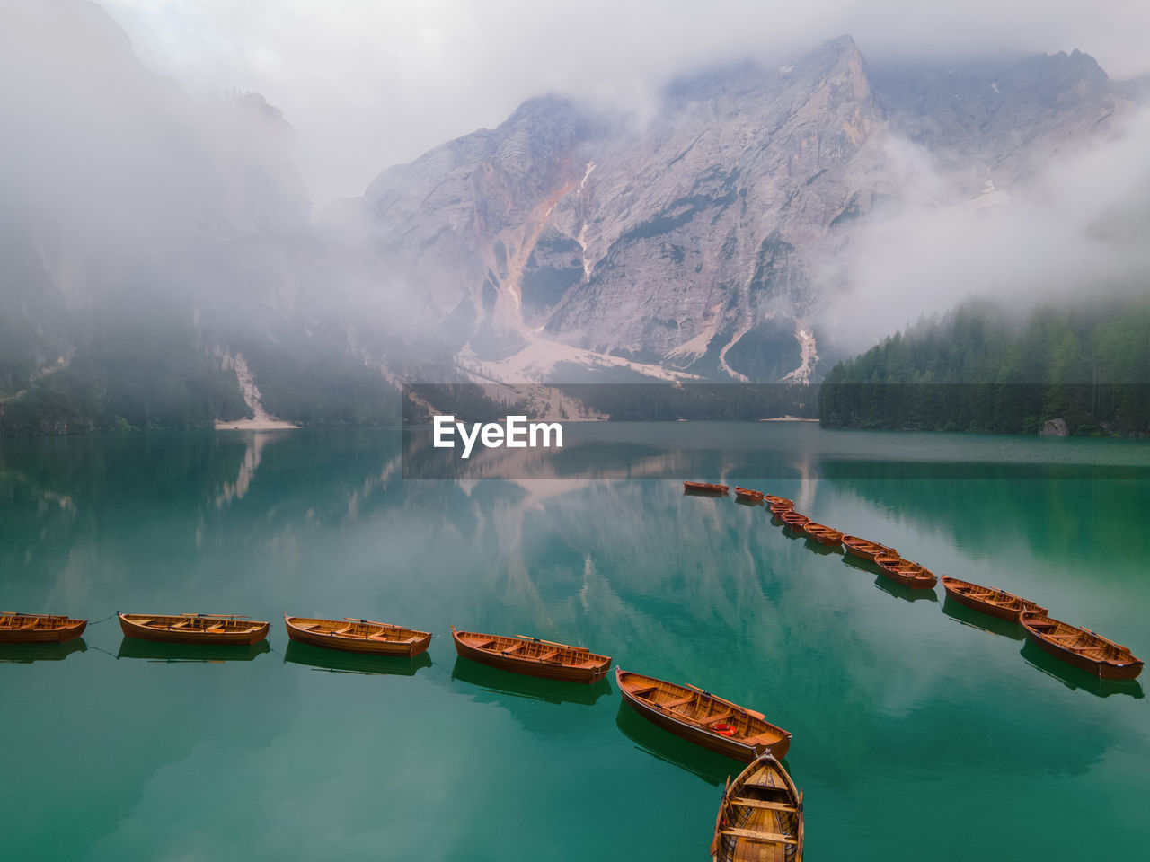 scenic view of lake against cloudy sky