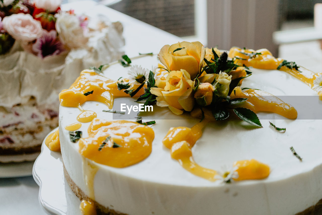 Delicious wedding cake with colorful flowers