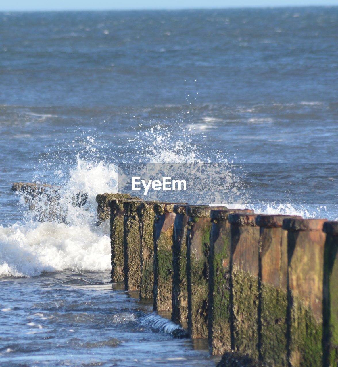 SEA WAVES SPLASHING ON BEACH