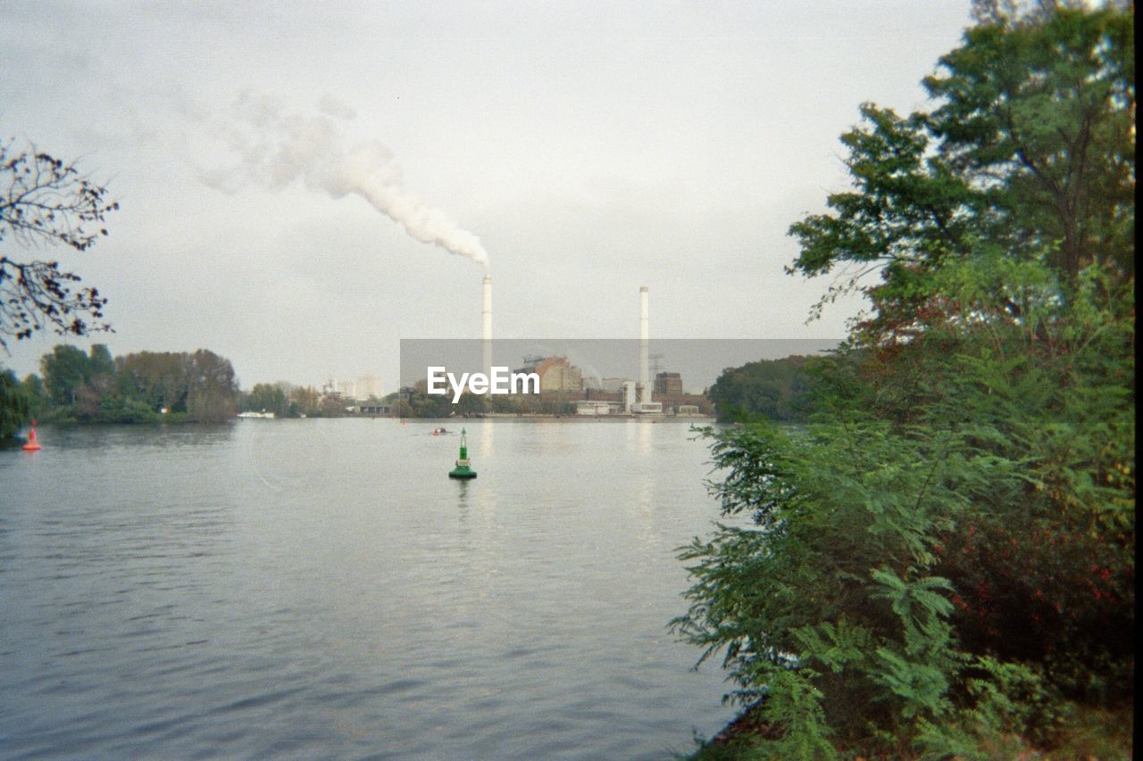 VIEW OF RIVER AGAINST CLOUDY SKY