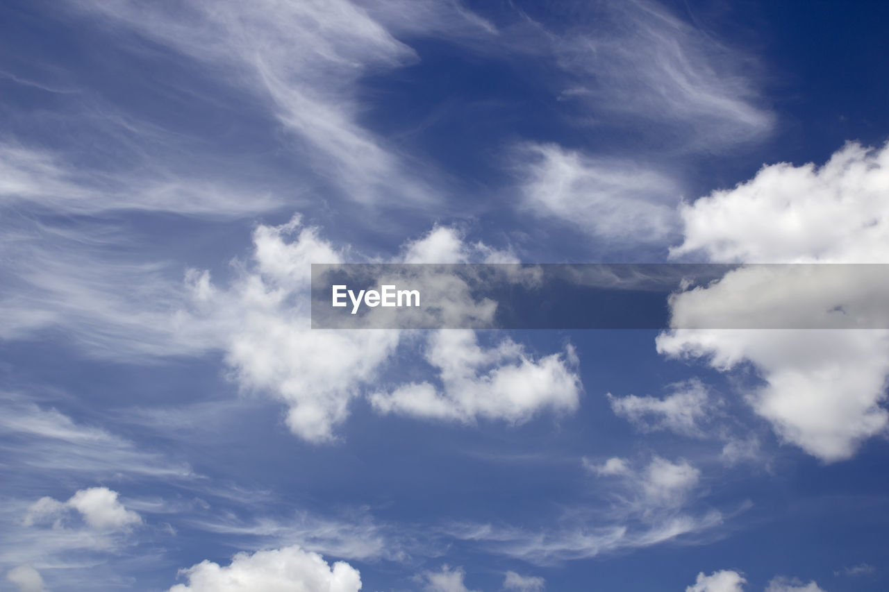 sky, cloud, daytime, blue, environment, backgrounds, cloudscape, nature, atmosphere, beauty in nature, wind, scenics - nature, dramatic sky, white, no people, fluffy, outdoors, idyllic, overcast, tranquility, sunlight, climate, meteorology, day, mid-air, summer, horizon, moody sky, low angle view, tranquil scene, copy space, bright, space, curve, high up, light - natural phenomenon