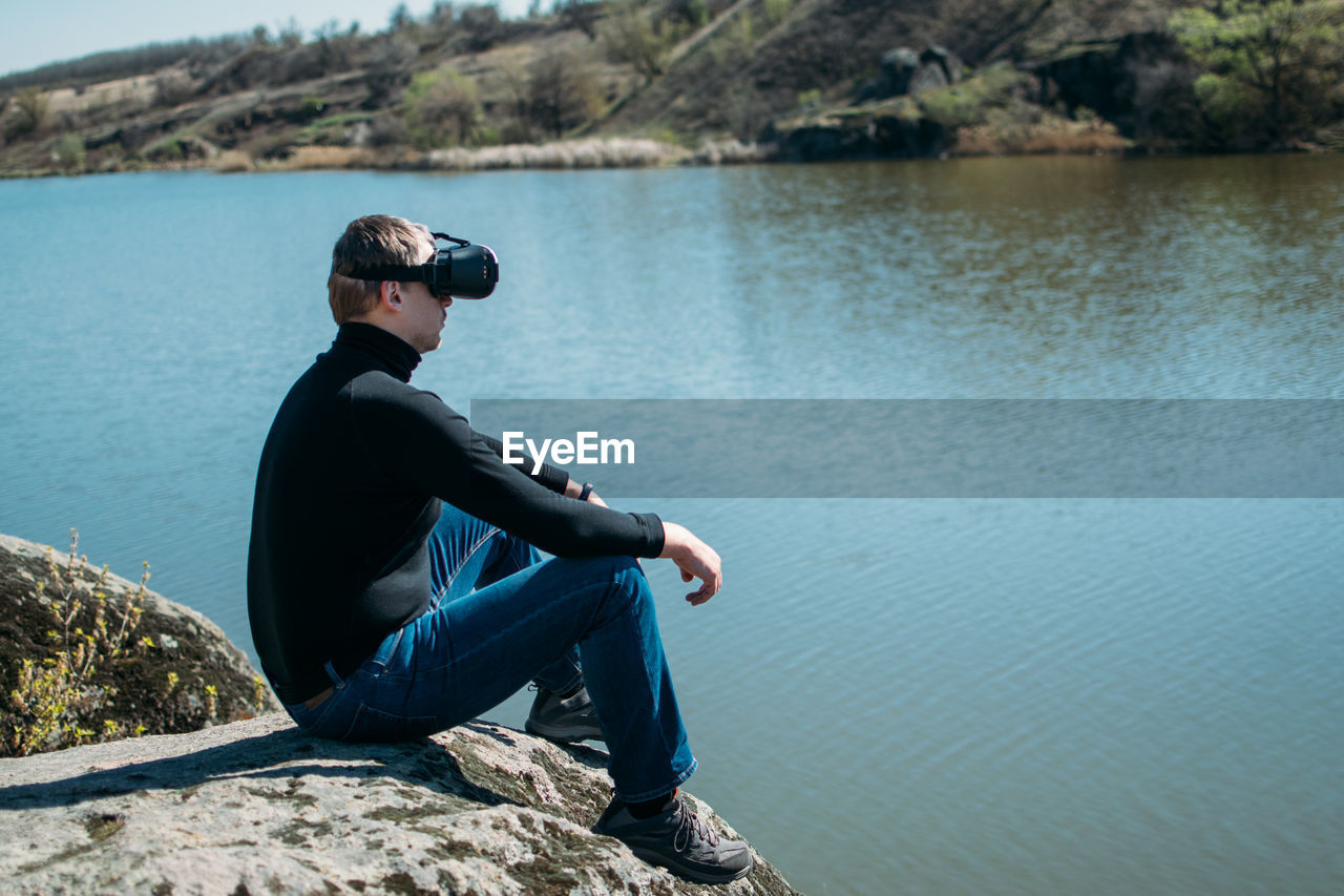 Virtual reality vs real life. future, modern technologies. man in vr virtual reality glasses