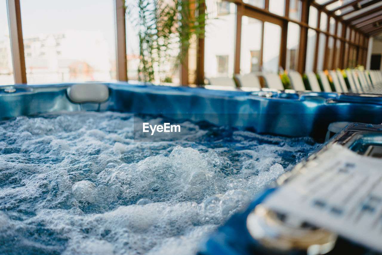 CLOSE-UP OF SWIMMING POOL AGAINST WALL