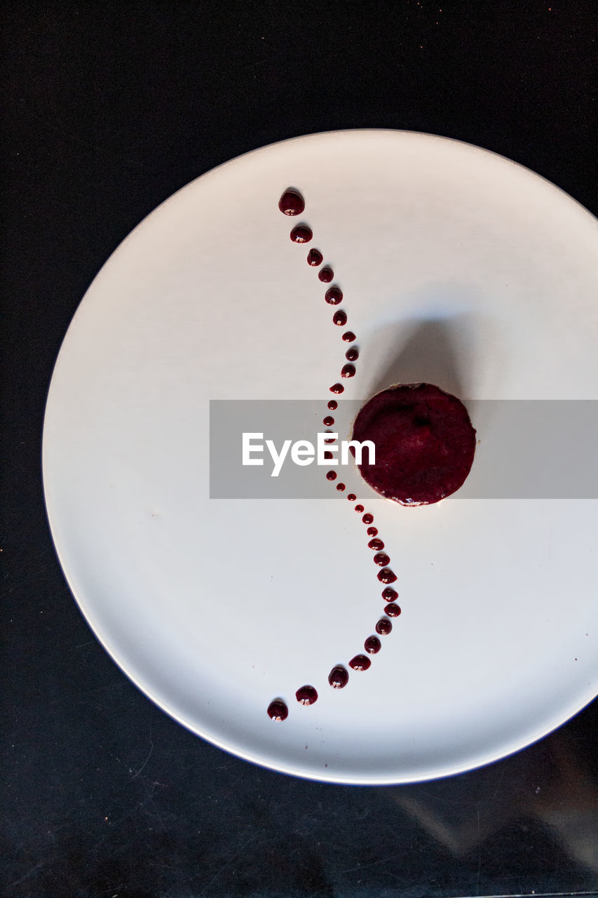 red, white, food and drink, no people, indoors, food, plate, sweet food, circle, high angle view, heart, heart shape, art, love, black background, blood, studio shot