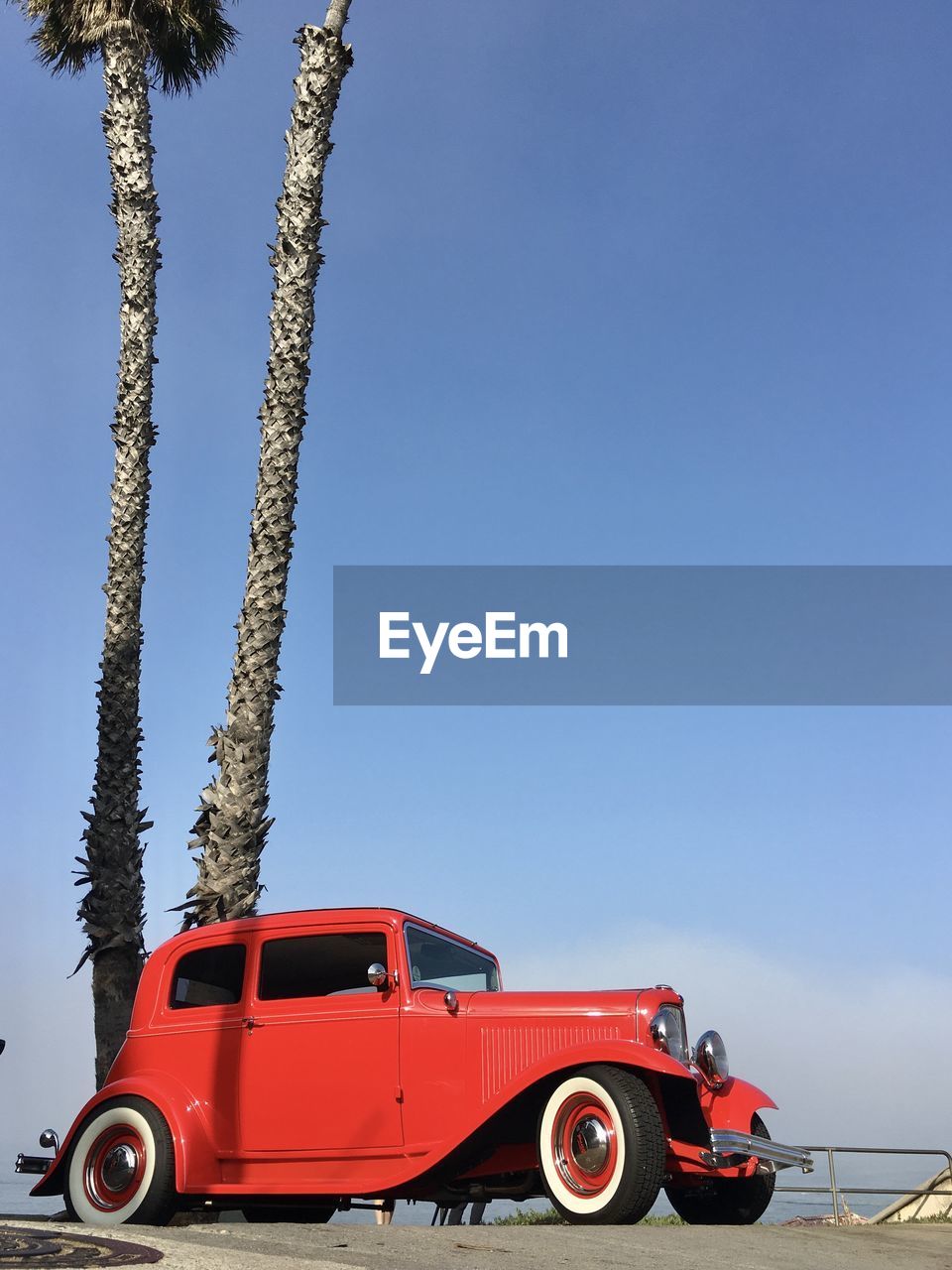 CAR AGAINST BLUE SKY