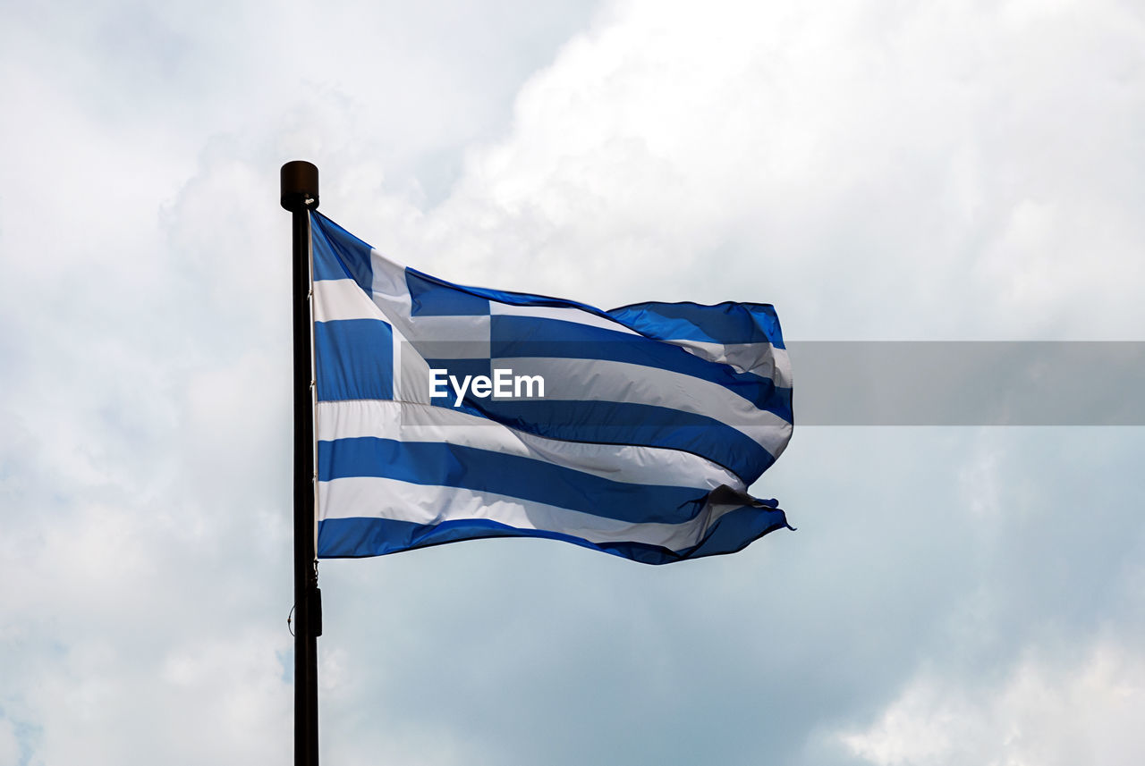 Flag of greece  -  low angle view of flag against sky