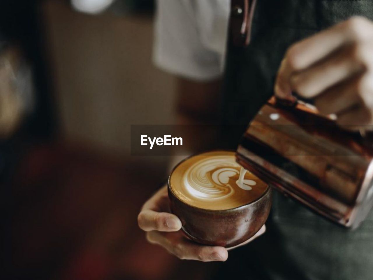 Midsection of woman holding coffee