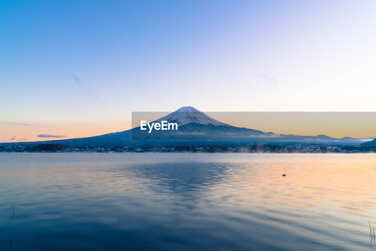 SCENIC VIEW OF SNOWCAPPED MOUNTAINS AGAINST CLEAR SKY