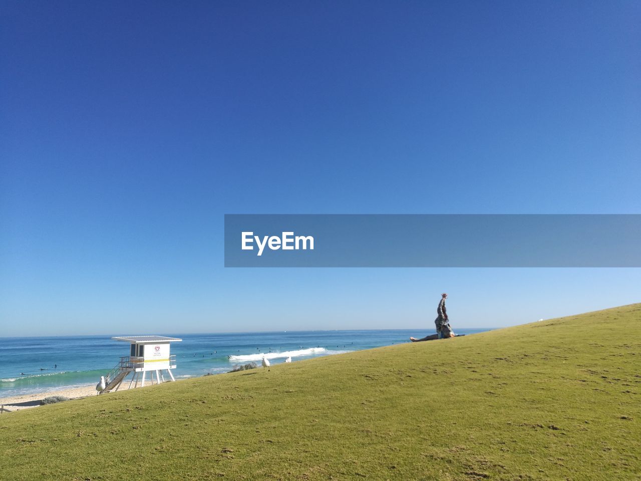 SCENIC VIEW OF BEACH AGAINST CLEAR SKY