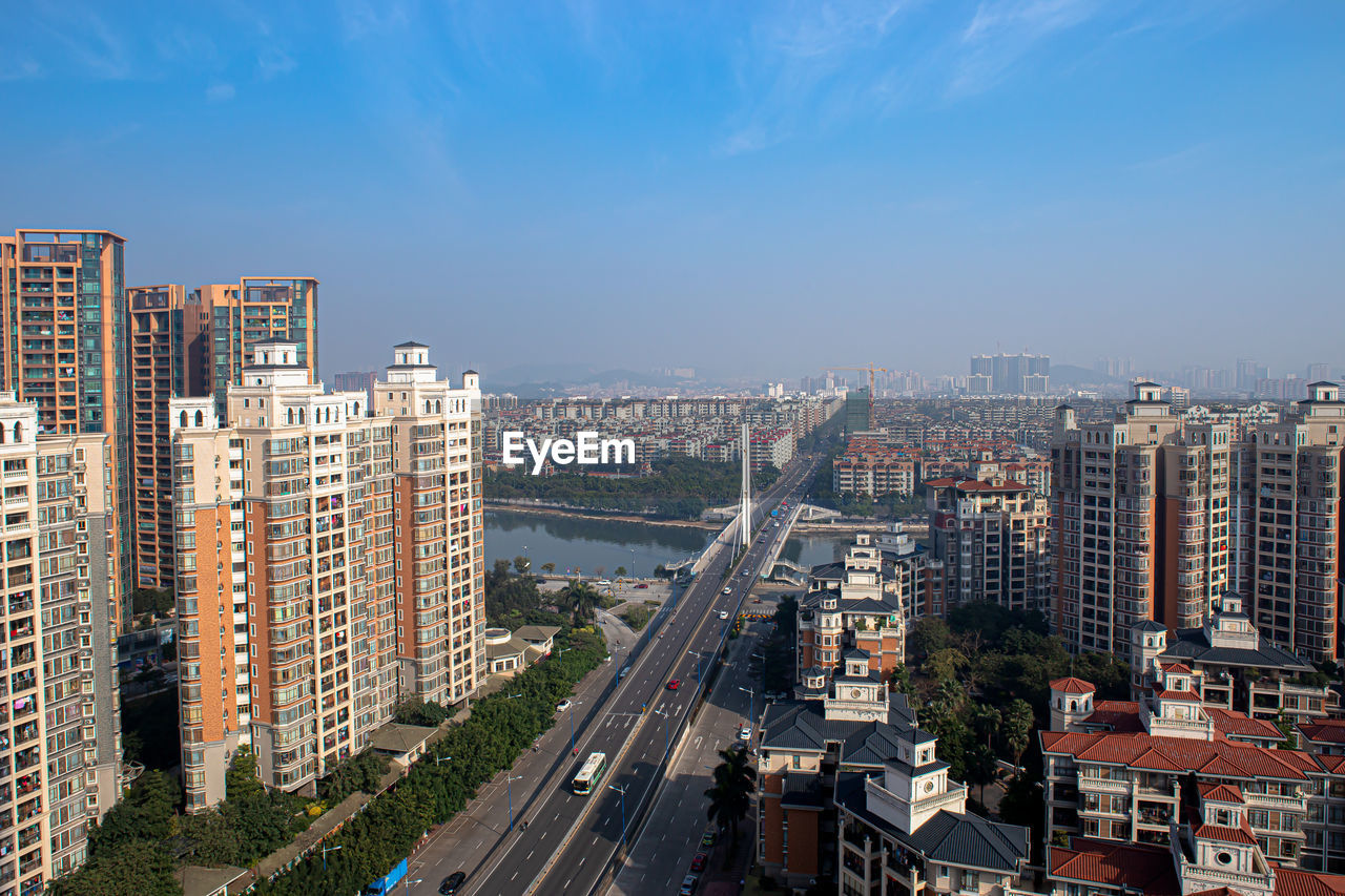 HIGH ANGLE VIEW OF STREET AMIDST BUILDINGS IN CITY