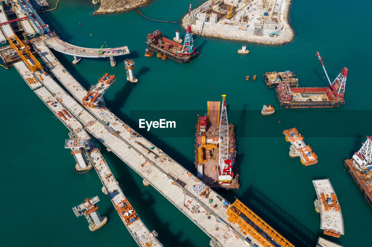 HIGH ANGLE VIEW OF SHIP MOORED IN HARBOR