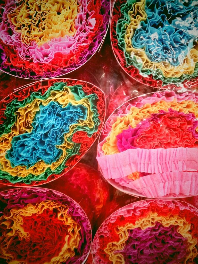 Multi colored crepe papers arranged in basket