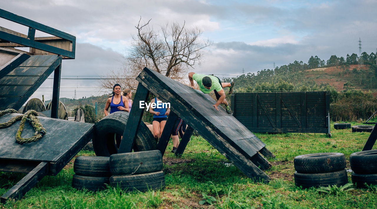 Friends practicing sport on land