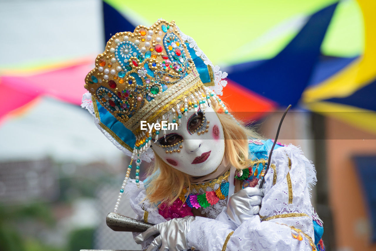 People dressed in different styles are seen playing at the carnival in the city of maragogipe,