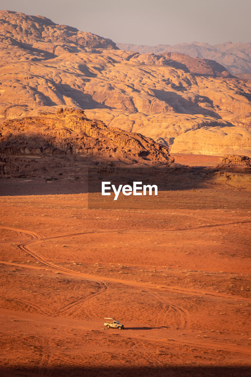 Scenic view of desert against mountain