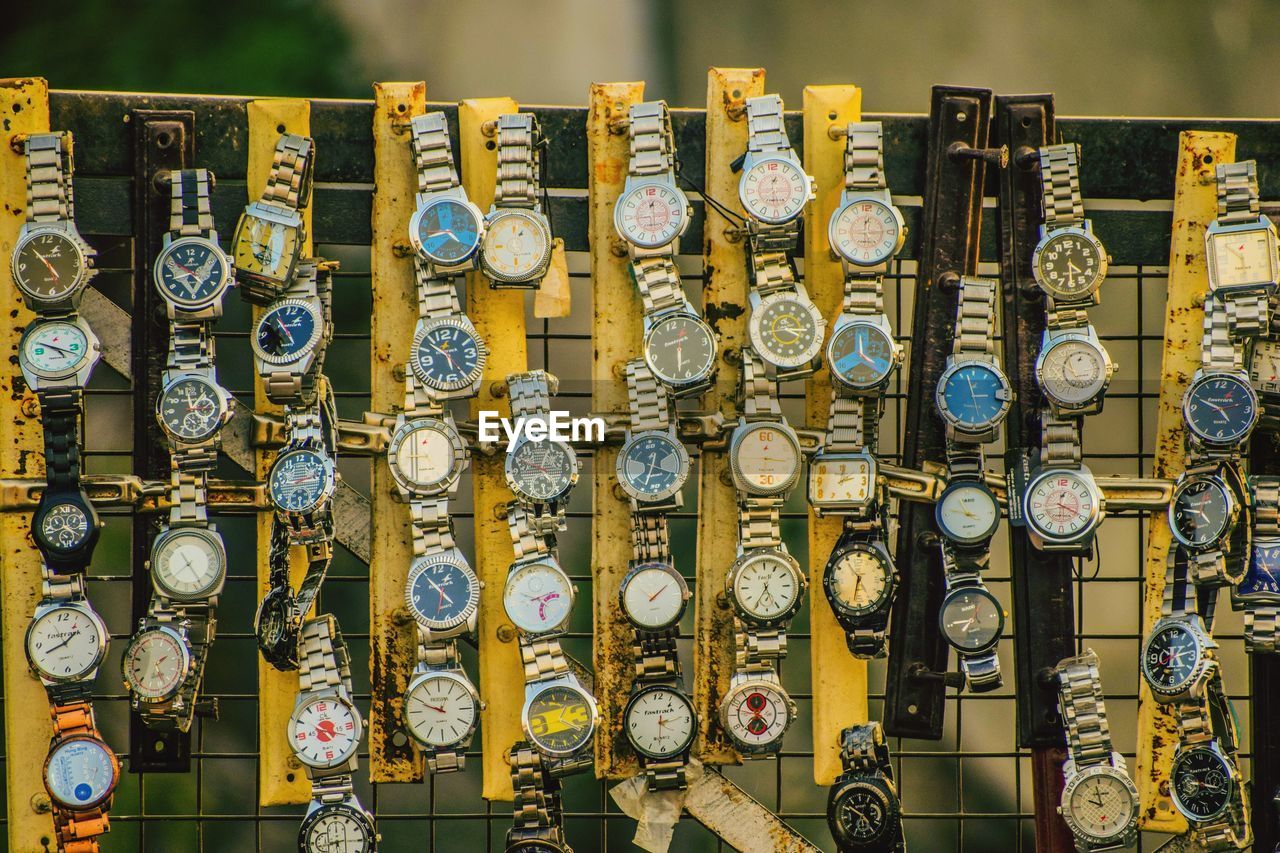 Wristwatch hanging in market for sale