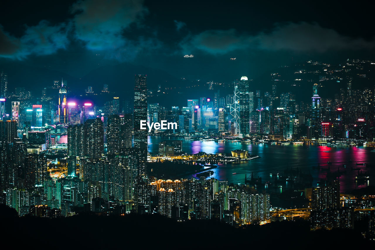 High angle view of illuminated buildings in city at night