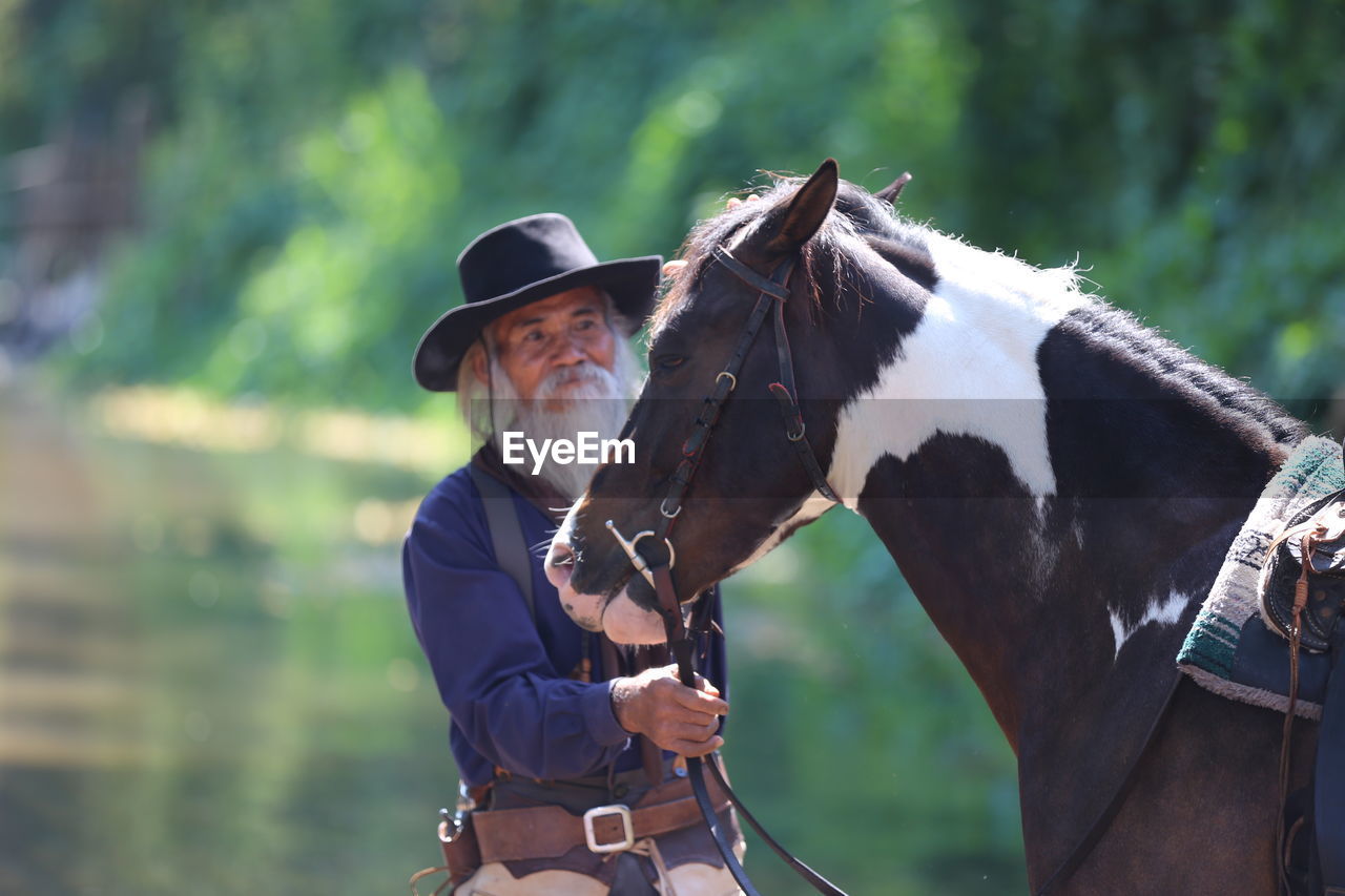 Portrait of man with horse